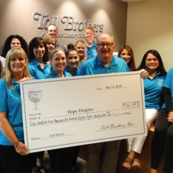 The Toll Brothers holding a check for $102,188 For Starr Hospice at charity Golf Castlewood Country Club