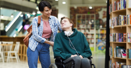 Mother with adult son in wheelchair