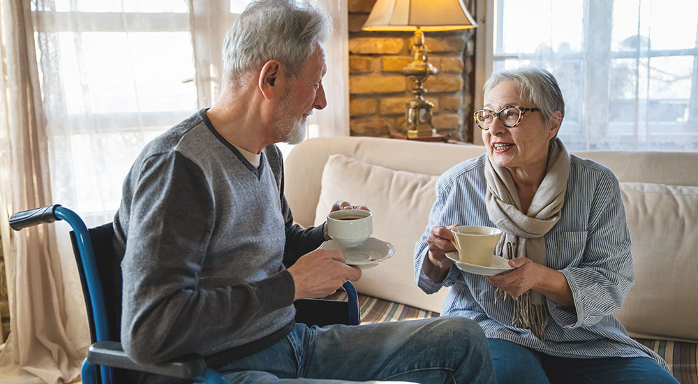 hospice chaplain talks with male patient